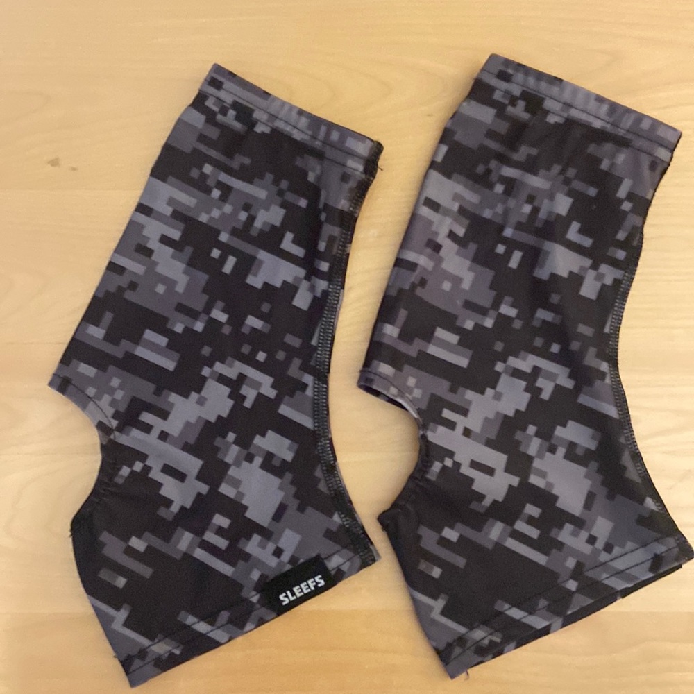 Sleefs football black and gray cleat spats.